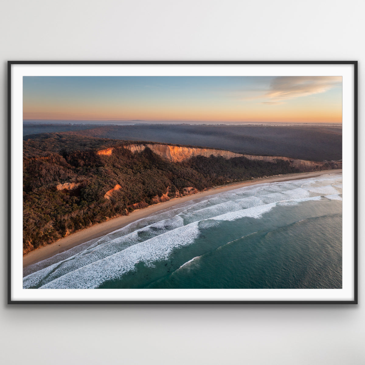 Detail of golden light illuminating Point Addis beach and rugged shoreline aerial photograph