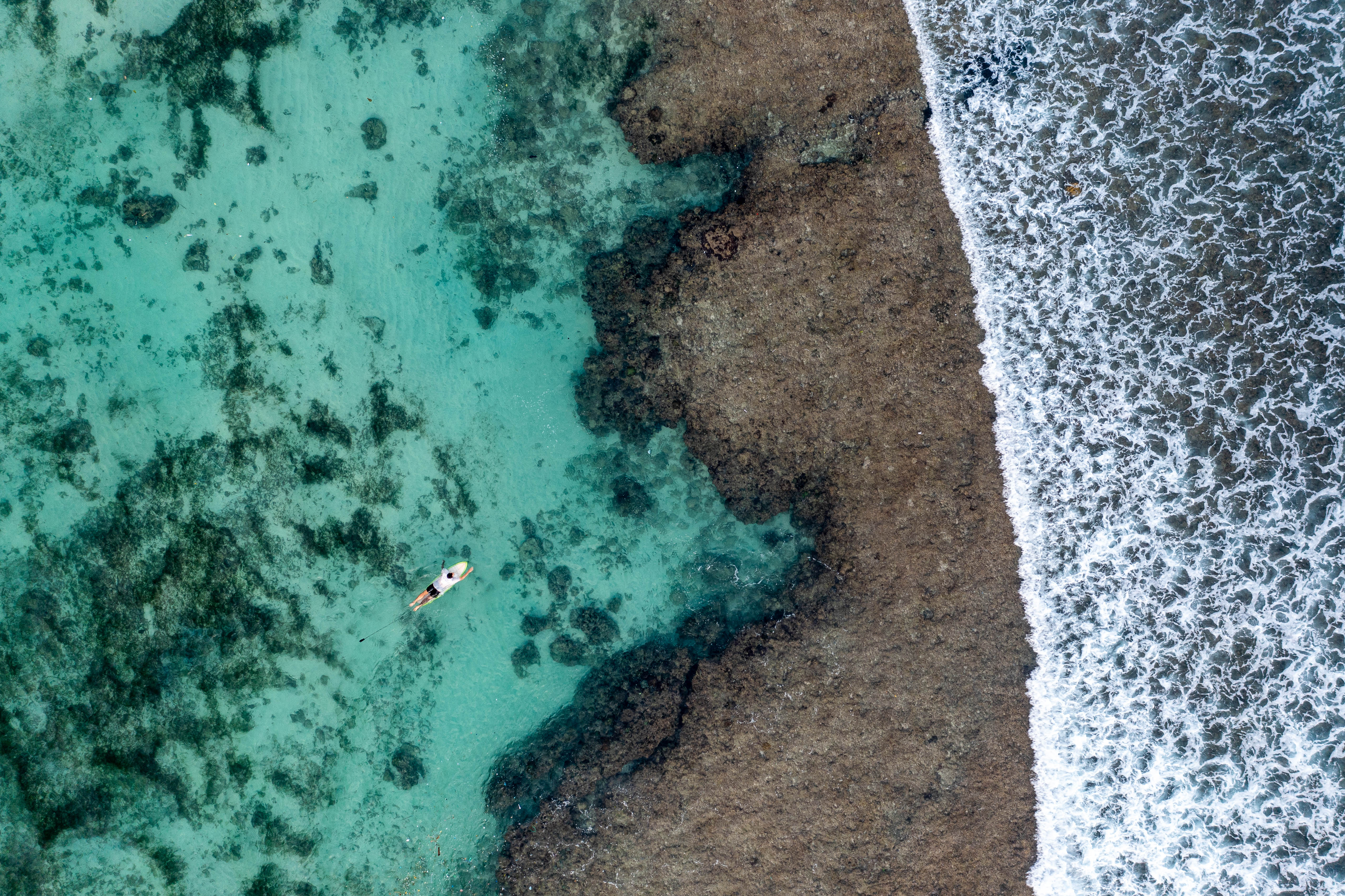 Bingin Surfer aerial photography print showing surfer and waves at Bingin Beach Bali