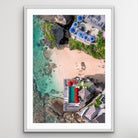 Top-down aerial photo of Uluwatu beach umbrellas in Indonesia”